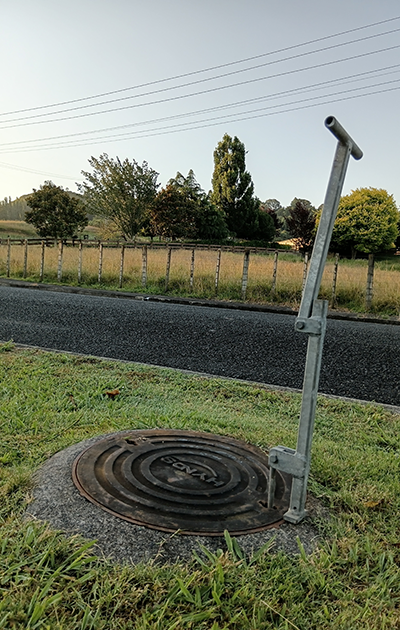 Cimino-conceived manhole cover lifter