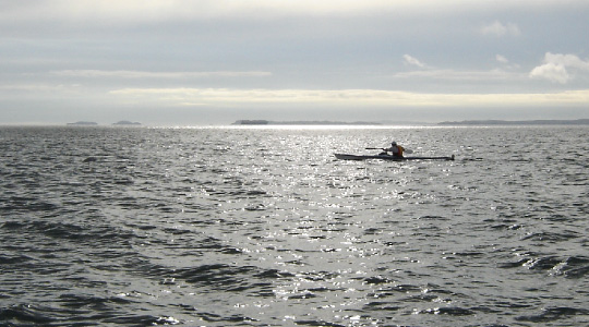 Steve Horne kayaks past Rangitoto Island