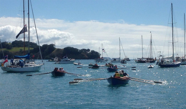 St Ayles skiffs arriving at Sullivans Bay